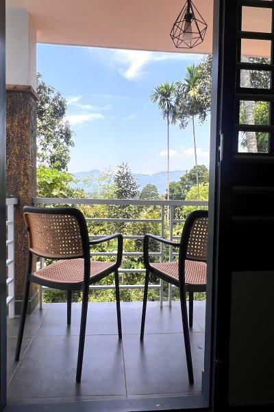 Balcony view over the hills at Villagio Homestay
