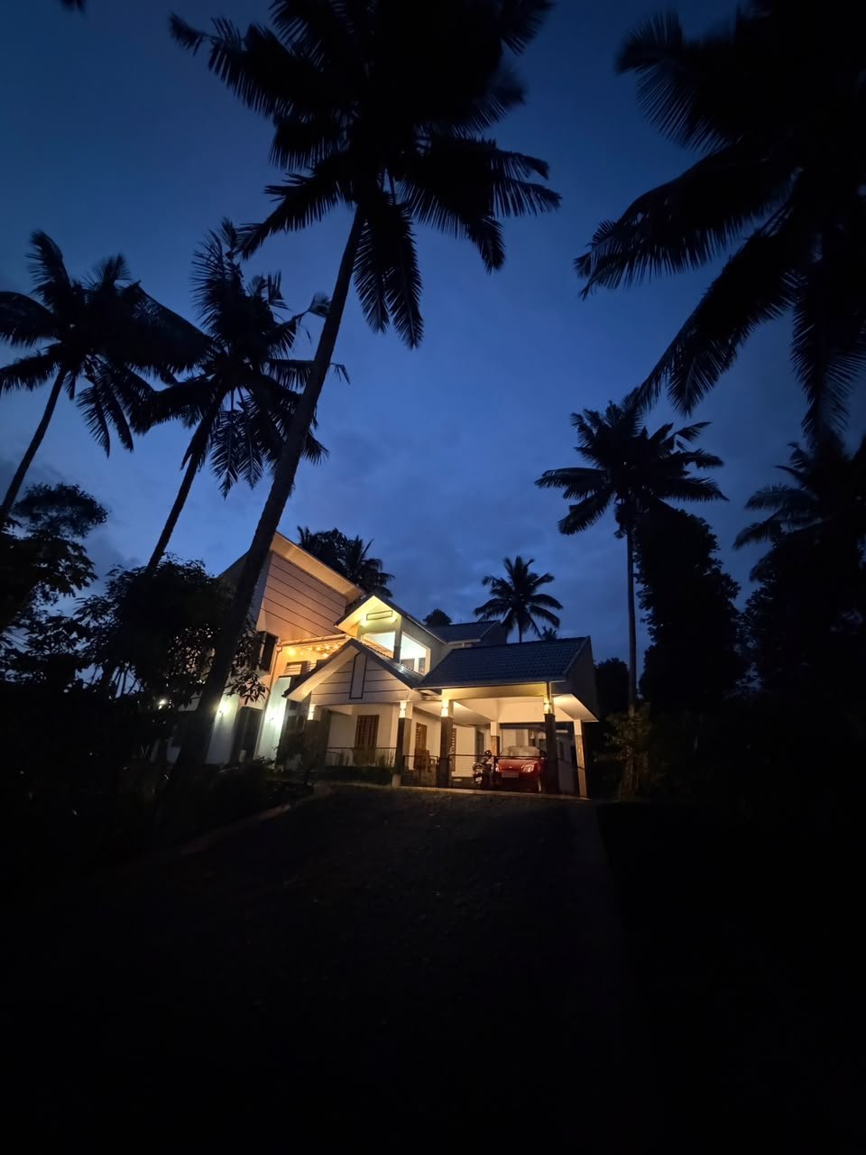 Villagio Homestay exterior at twilight